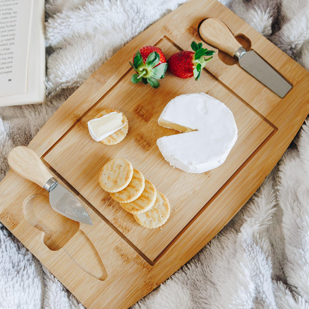 Bamboo cheese board with utensils