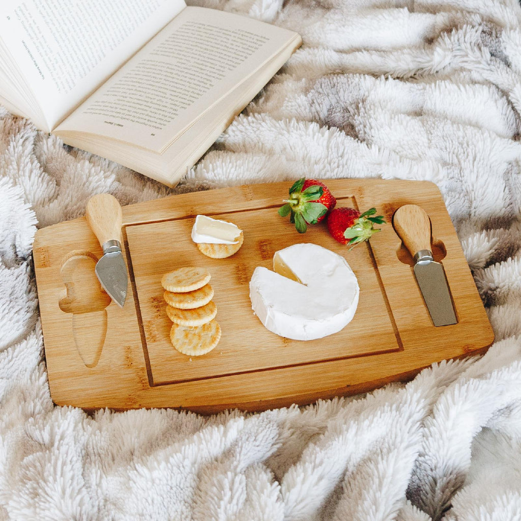 Bamboo cheese board with utensils