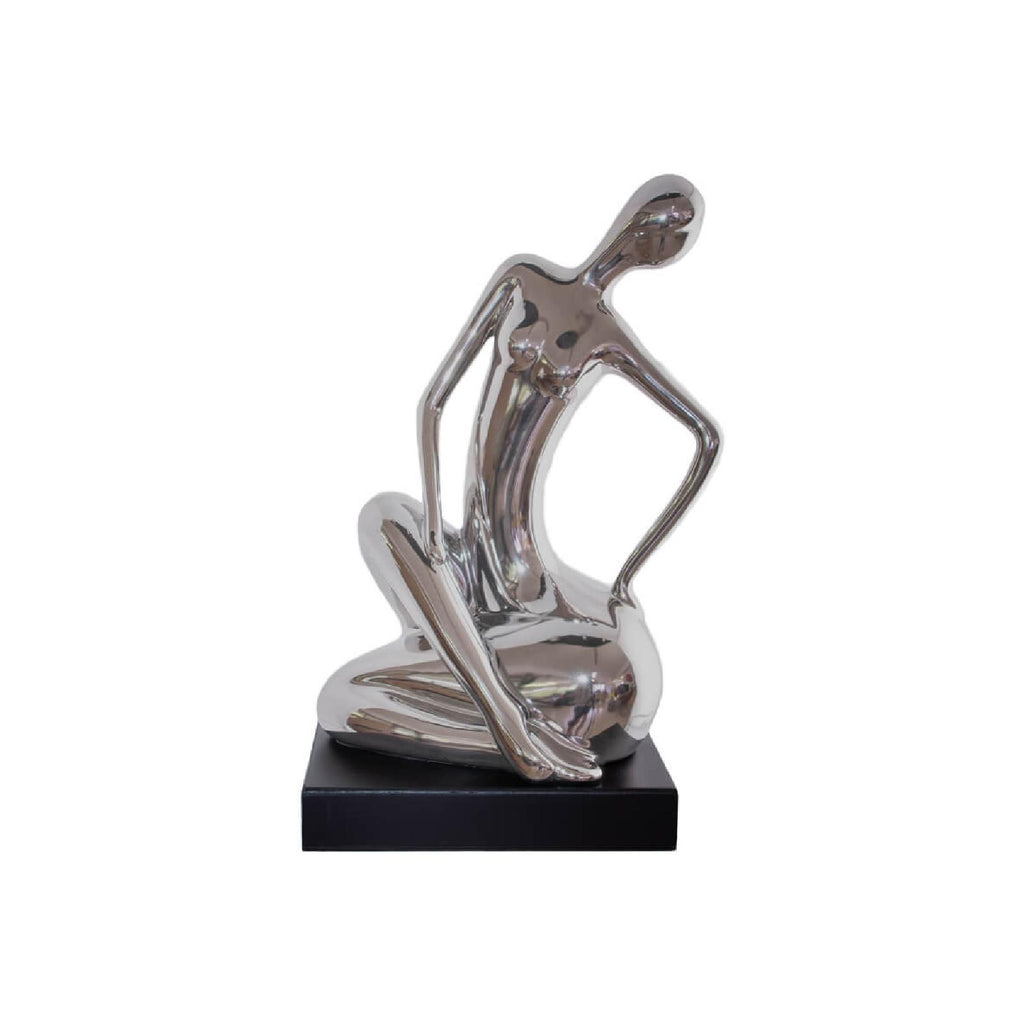 Silver sitting figurine